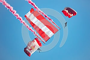 Paratrooper flying in the sky. Extreme sport and Xgames. Jumping with Austrian flag