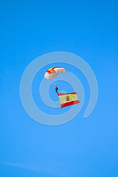 Paratrooper in full flight with the flag of Spain