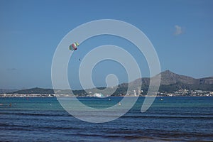 Paratrooper parachutist over the sea in Mallorca