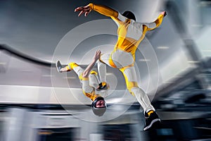 Paratrooper. Speedfly start. Fly men is a pilot of his body in air. Parachutist in yellow suit. Air sport as a way of
