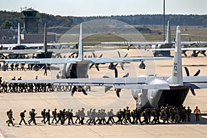 Paratroopers entering a US Air Force C-130 Hercules transport plane on Eindhoven airbase