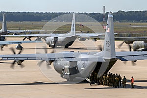 Paratroopers entering a US Air Force C-130 Hercules transport plane on Eindhoven airbase