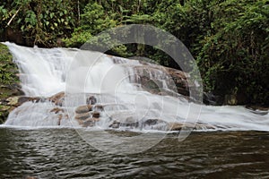 Paraty/Rio de Janeiro/Brazil - Pedra Branca waterfall, touristic place. Cold water runs through the rocks