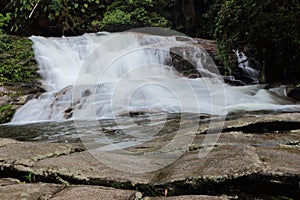 Paraty/Rio de Janeiro/Brazil - Pedra Branca waterfall, touristic place. Cold water runs through the rocks