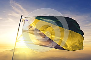 Parauapebas of Brazil flag waving on the top sunrise mist fog photo