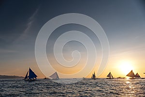 Paraw sailing at Boracay Island, Philippines at Sunset