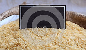 Parboiled rice in a sack with a label