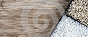 Parboiled white rice and integral rice on the wooden table background