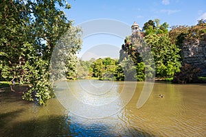 Parc des buttes Chaumont lake on a sunny day