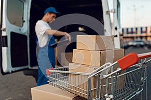 Parcel boxes in cargo cart, delivery service