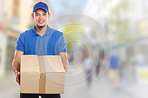 Parcel delivery service box package order delivering job young latin man town copyspace copy space