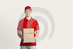 Parcel shipping and home delivery. Courier holds boxes
