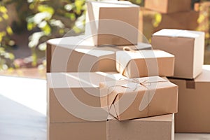 Parcel with tag and blurred stacked boxes on background photo