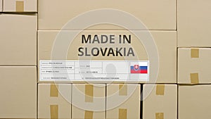 Parcel with MADE IN SLOVAKIA text and flag, production and transportation concept