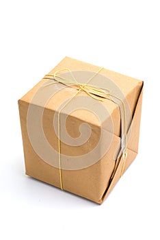 Parcel wrapped in brown paper and tied.