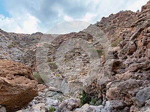 Parched riverbed called wadi in Asia, in the outskirts of Muscat, Oman