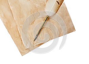 Parchments and feather pen on white background, top view