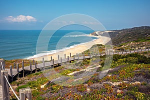 Paredes Panoramic Boardwalk. The wooden stairway on the rocky seashore