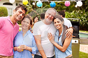 Parent With Adult Children Enjoying Party In Garden