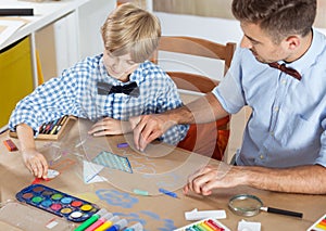 Parent and child drawing together