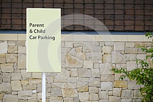 Parent and child parking sign at supermarket shop car park