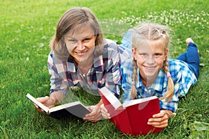 Parent and child reading books together