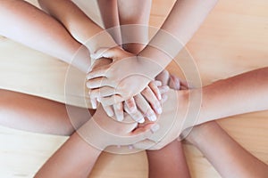 Parent and children holding hands together