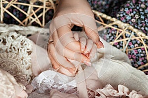 Parent hands holding newborn baby fingers, Close up mother`s hand holding their new born baby. Love family healthcare and medical