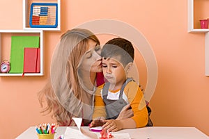 Parent learning and playing with kids. Mother or teacher learning english letters with children.Homeschooling