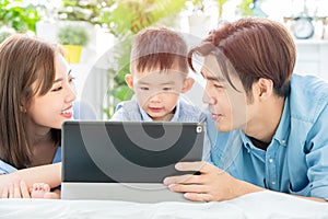 Parent play with child by tablet photo