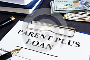 Parent plus loan form and documents in office.