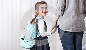 Parent and primary school student go hand in hand