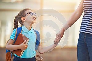 Parent and pupil go to school