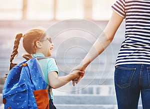 Parent and pupil go to school