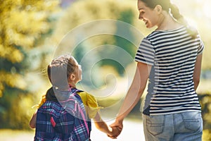 Parent and pupil go to school