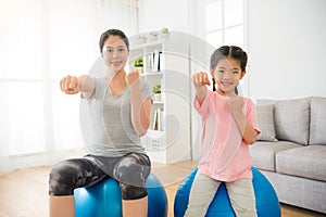 Parent sporting with children showing fist