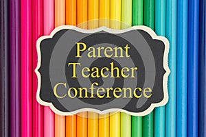 Parent teacher conference message on chalkboard photo