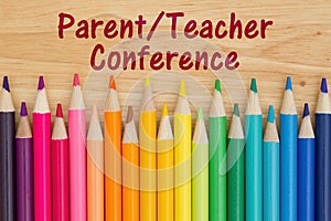 Parent teacher conference message with pencil crayons photo