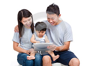 Parent using tablet with thier baby son