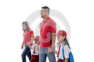 Parent walk their children to school for the first time