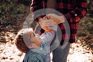 Parental support. Help kid explore world. Dad hold hand of little boy. Manly father upbringing little child. Trust and