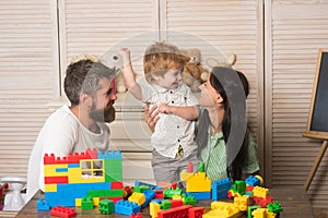 Parenthood concept. Young family with happy faces