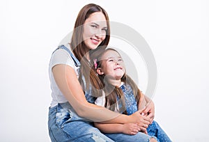 Parenting, family and children concept - Portrait of a mother and her baby girl have fun and smiling over white