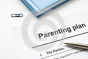 Parenting plan document and pen for signature. photo