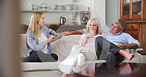 Parents With Adult Offspring Using Digital Devices At Home