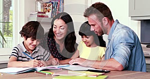 Parents assisting children doing homework