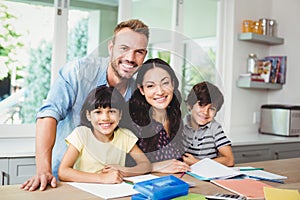 Parents assisting children doing homework