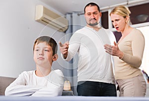 Parents berating frustrated boy