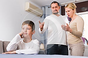 Parents berating frustrated boy