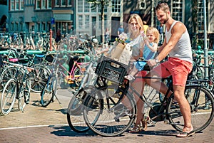 Parents on bikes at the streets of Amsterdam